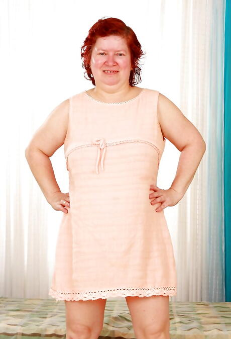 Sexy redhead grannie Hana showing big boobies and hairy twat 